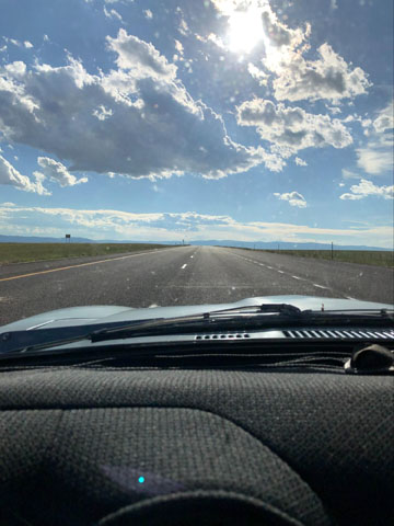 road with dramatic clouds